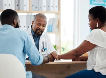 doctor-black-couple-holding-hands-600nw-2283175561